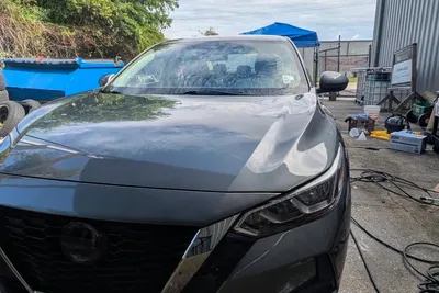 Sedan mid contact wash with shampoo foam over the paint