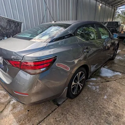Sedan exterior after a full hand wash, wheels and tires cleaned